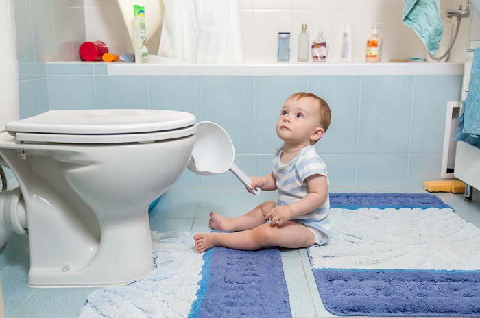 baby near toilet bowl